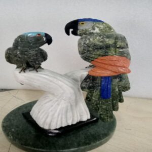2 Small Parrots on A Stone Tree Bark